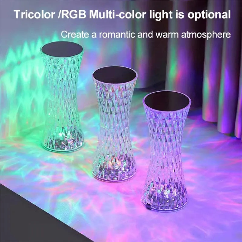 Vase-shaped crystal table lamp with diamond-like LED lighting on wooden surface