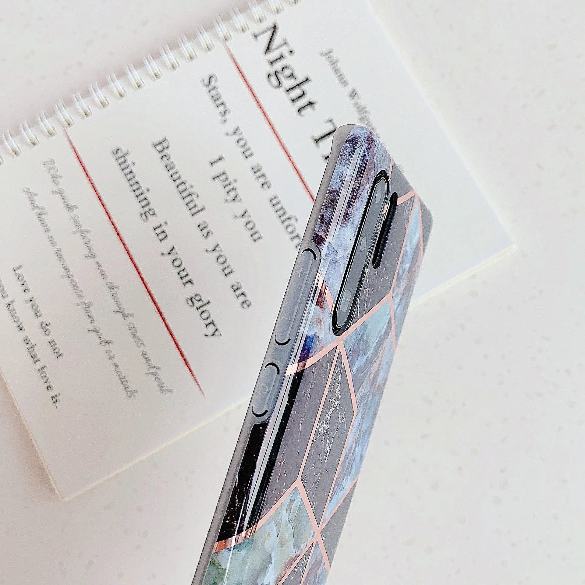 Electroplated marble pattern TPU back cover case for a Huawei or Samsung smartphone.