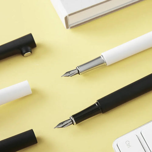 Branch magnet red dot award fountain pen with 0.7mm stainless steel nib in black or white resin holder.