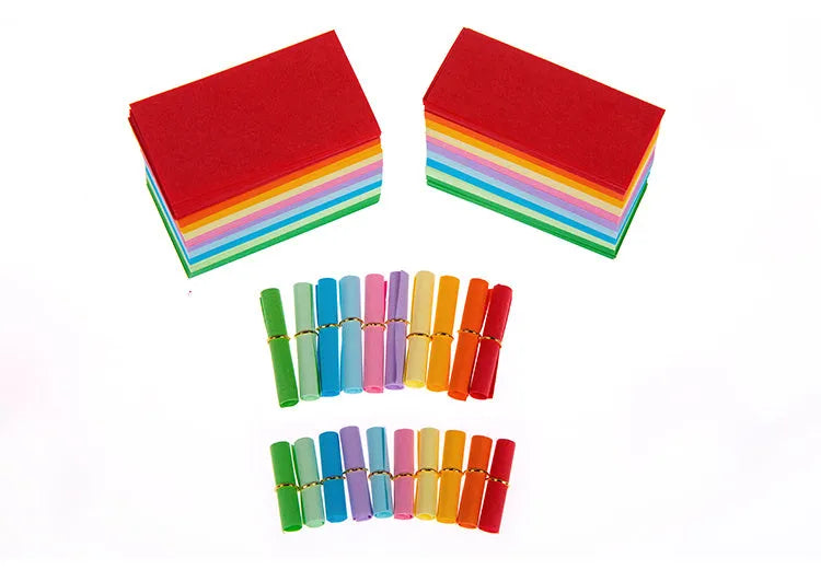 Colourful mini letter paper scrolls with eyelet holes for bottle messages in multiple sizes