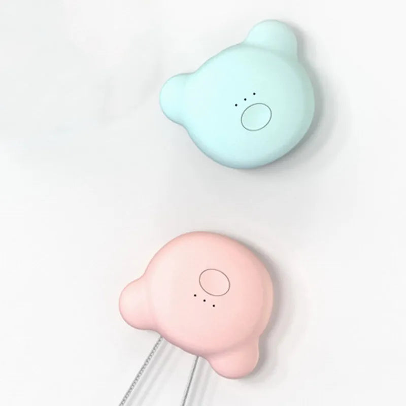 Pink portable USB air purifier necklace with charging cable showing compact wearable design