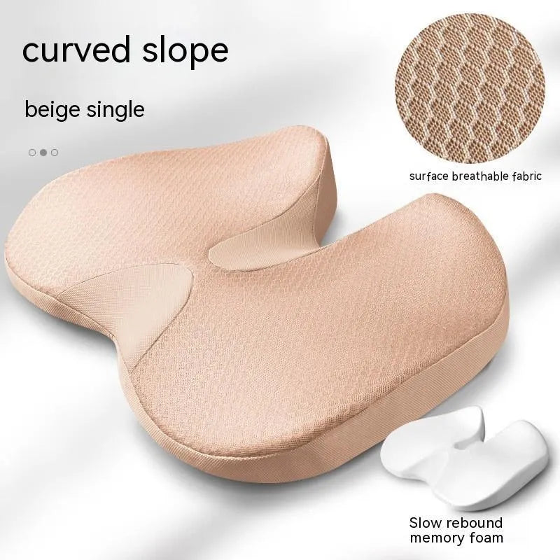 Curved wedge seat cushion for tailbone support in car, shown in beige colour with memory foam interior