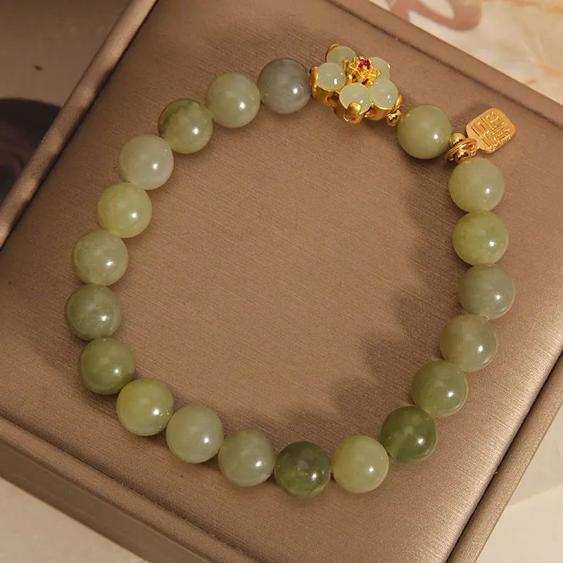 Women's casual fashion bracelet in a grey jade colour with alloy metal construction.