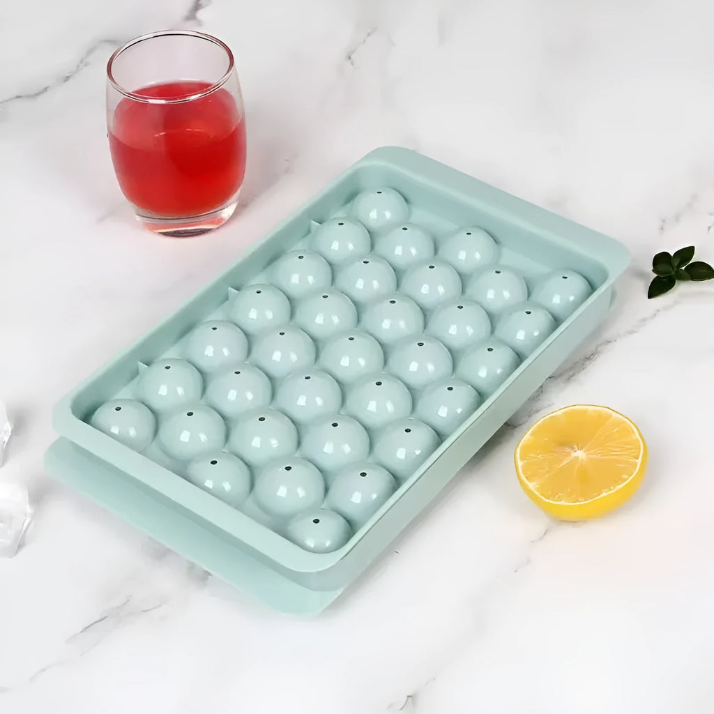 Blue silicone ice cube tray with lid showing 33 round grids for homemade ice