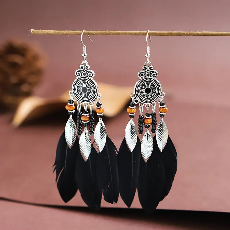 Handmade feather pattern bohemian earrings in multiple colours with leaf design detail