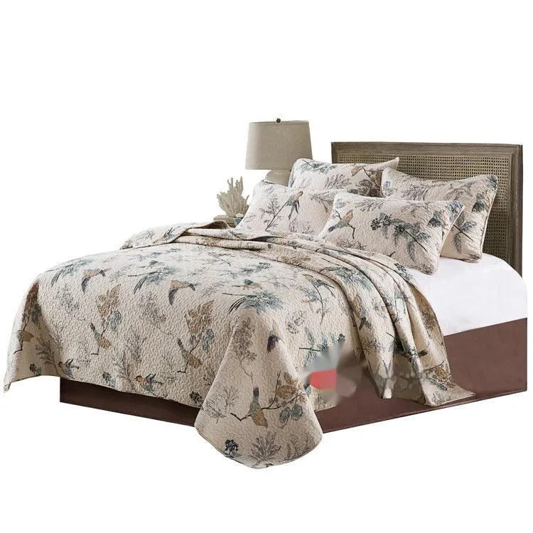 Pure cotton quilt cover set with patterned bedspread and two pillowcases on a bed.