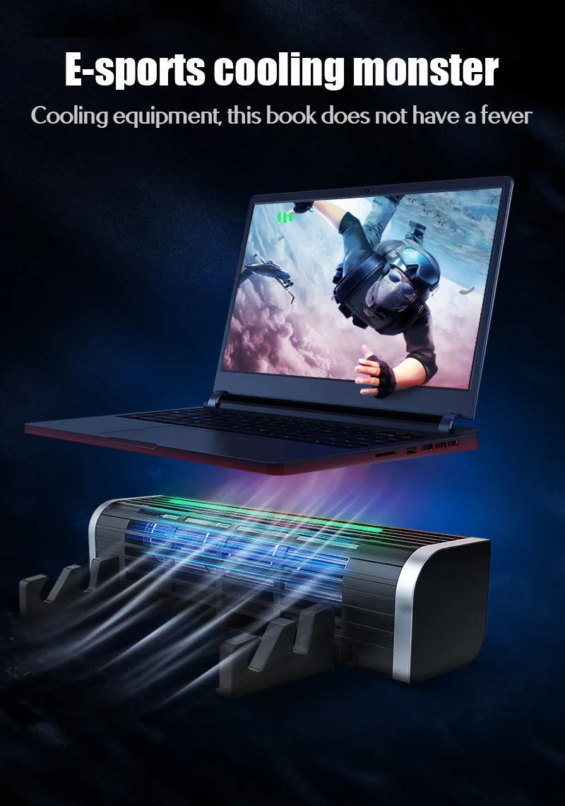 Black notebook cooler with dual fans and USB cable on a wooden desk next to a laptop