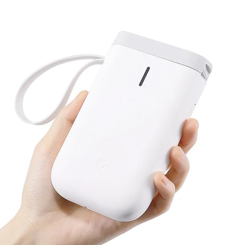 D11 Bluetooth thermal label printer with compact black design shown next to printed labels