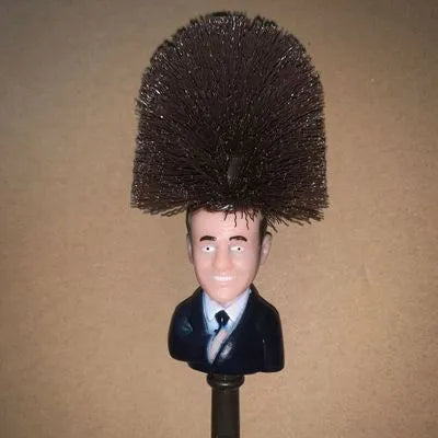 Yellow plastic Donald Trump toilet brush with 40cm length and hanging slot handle