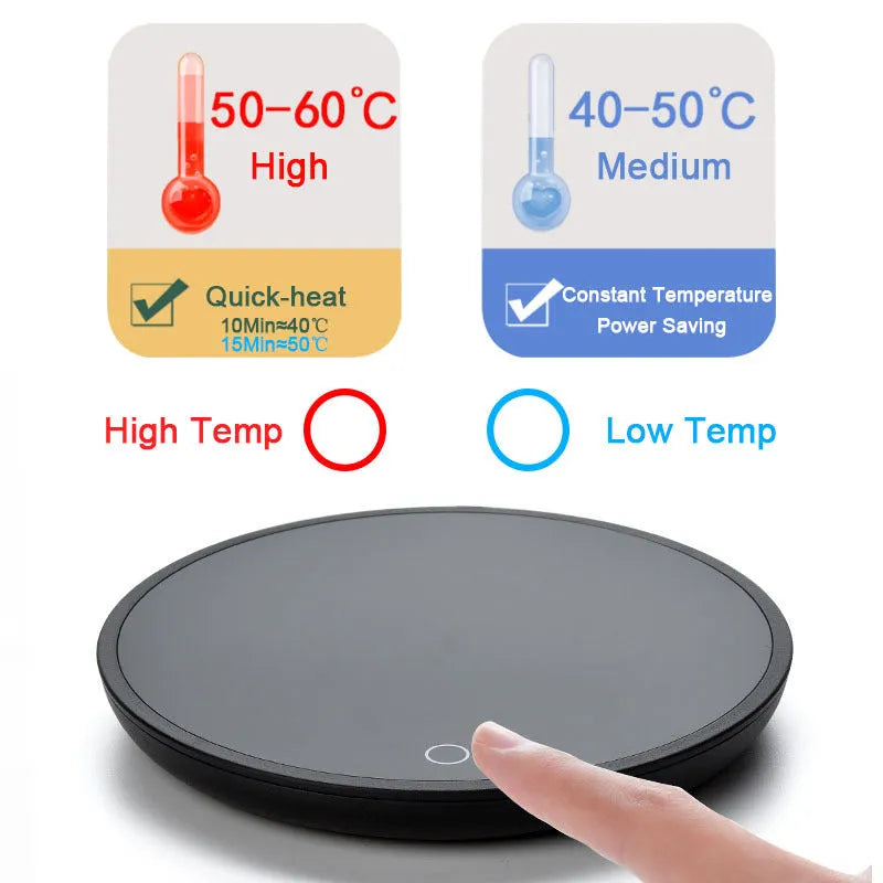 Black round desk cup warmer with tempered glass surface and low high switch on a wooden table.