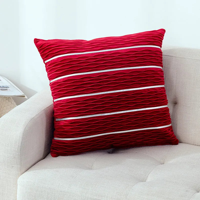 Square striped velvet pillow cover for sofa in multiple colour options on a grey background.