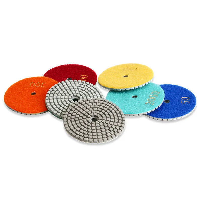 Set of 10 stone polishing pads with emery abrasive, showing 80mm diameter and central 10mm hole.