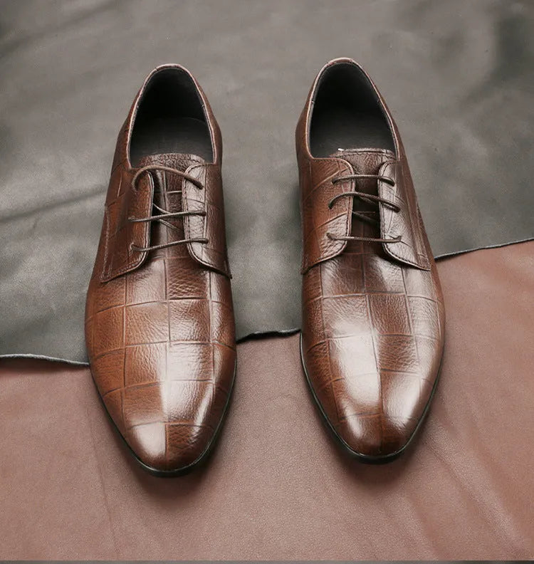 Men's black leather derby shoes with checkered pattern and pointed toe design on rubber soles