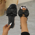 Women's leopard print beach slippers with round toe and thick sole in black or white