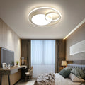 Modern minimalist round LED ceiling light in white with wrought iron frame and acrylic shade.
