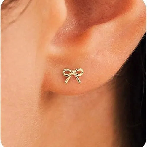 Women's gold and silver bow or cross stud earrings with geometric designs