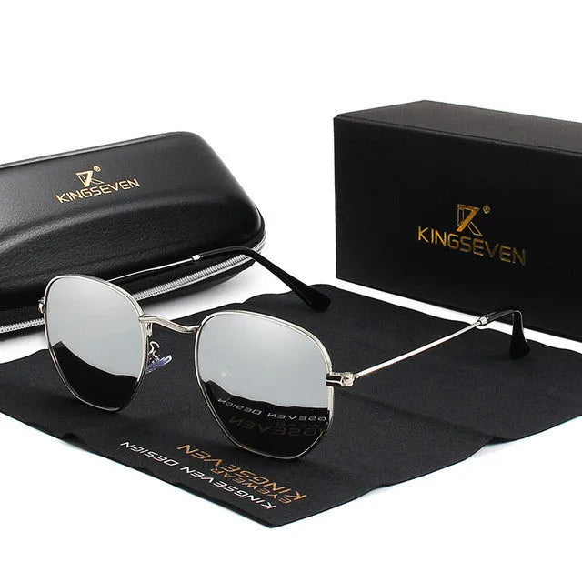 Classic round retro sunglasses for men in gun grey finish with UV400 lenses on a wooden table.