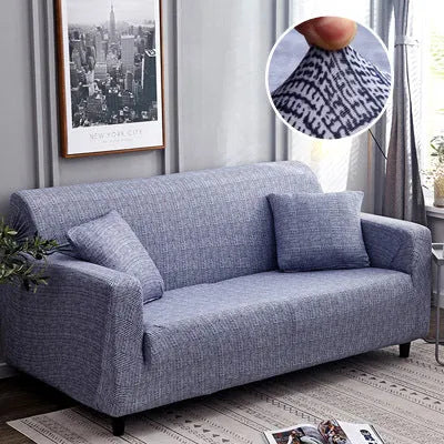 Geometric patterned stretch sofa slipcover fitted on a three-seater sofa