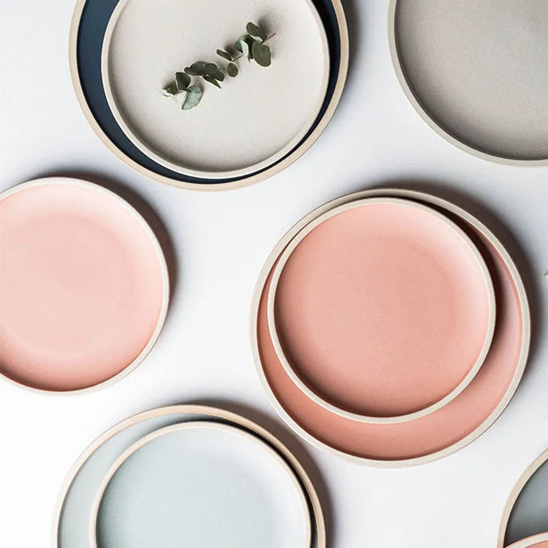 10-inch pure blue matte finish ceramic dinner plate on a table.