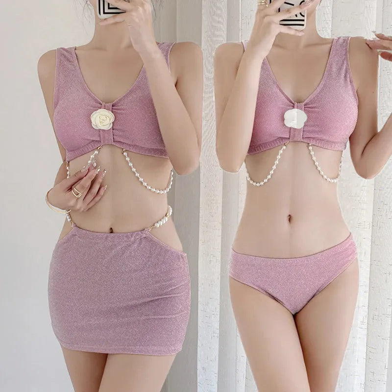 Women's pink and black three-piece bikini swimsuit with briefs styling