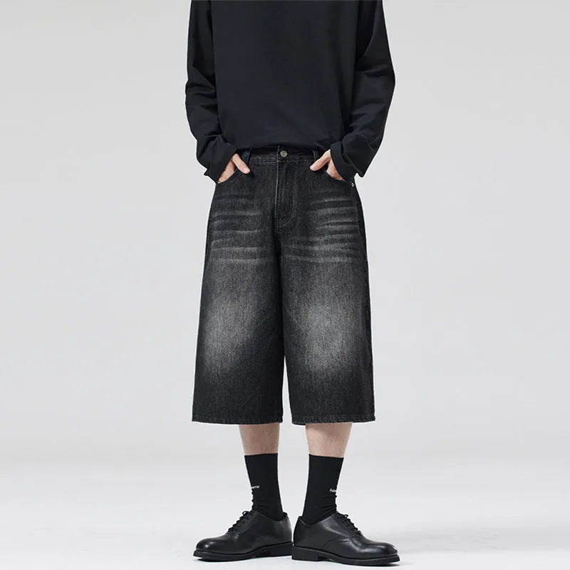 A pair of light blue denim shorts with a loose straight leg and cropped length on a neutral background.