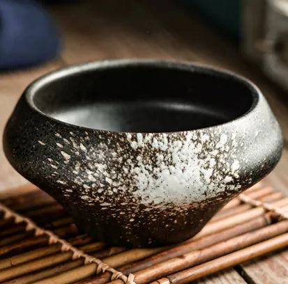 Tall porcelain ceramic Japanese soup bowl with underglaze vintage pattern on wooden table.