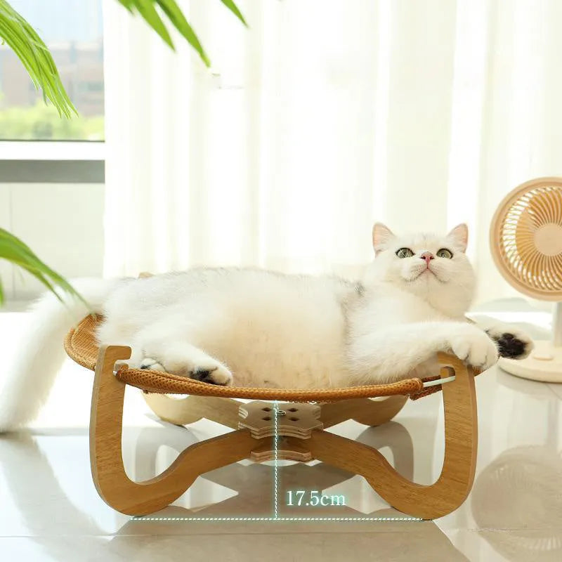 Brown woven rattan pet hammock bed raised off the ground