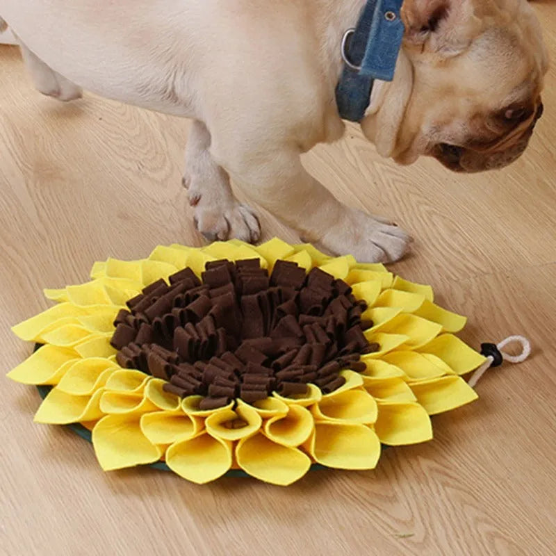 Yellow sunflower-shaped dog snuffle mat with rope and buckle attachment for slow feeding