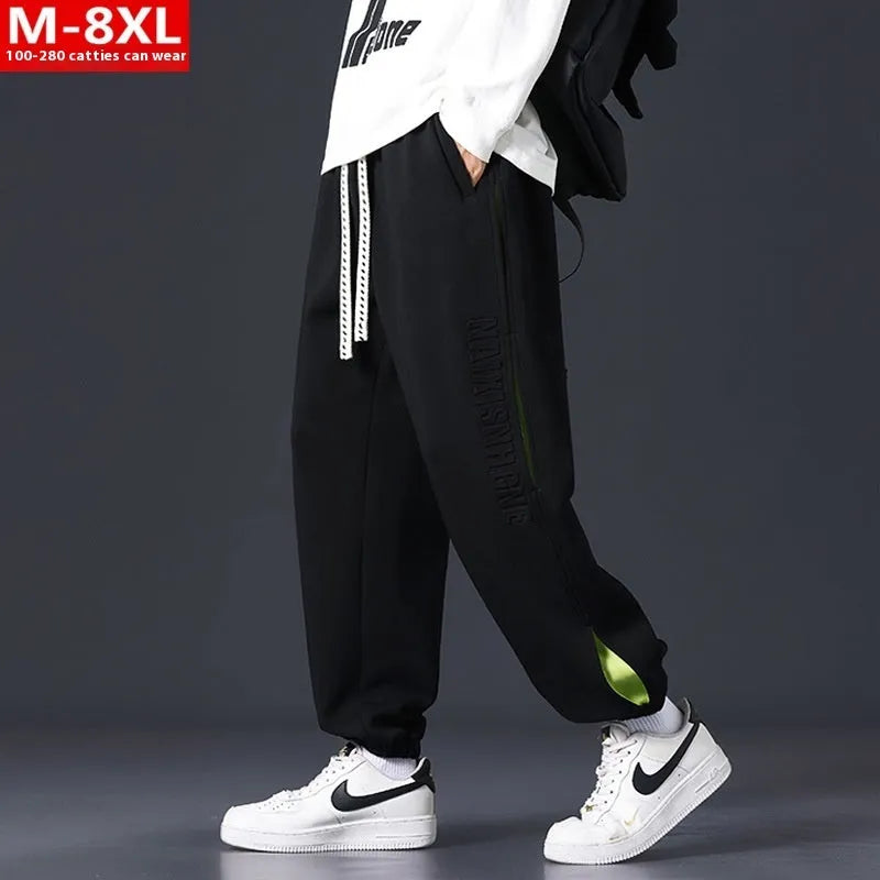 Men's loose cotton trousers with stitching detailing and ankle banding in grey green colour