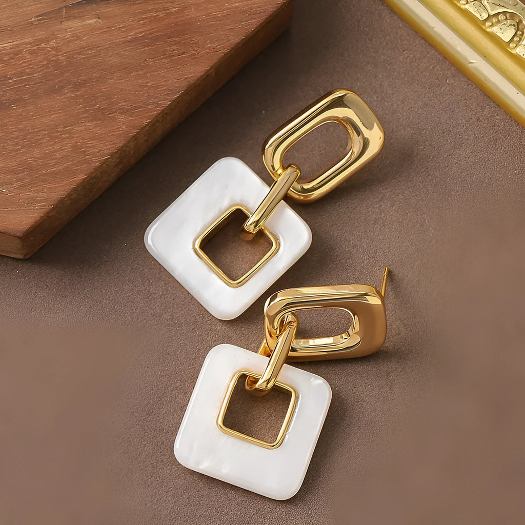 Hollow geometric square earrings with chamfered corners in electroplated copper