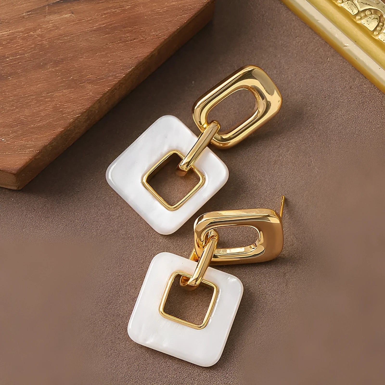 Hollow geometric square earrings with chamfered corners in electroplated copper