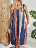V-neck sleeveless dress with striped colour block pattern on a mannequin.