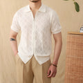 Light brown cotton short sleeve cardigan with a front zipper and lapel collar on a hanger.