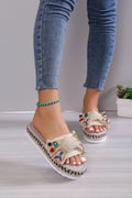 Creamy-white women's platform sandals with a cloth upper, round toe, and a decorative beach bow.