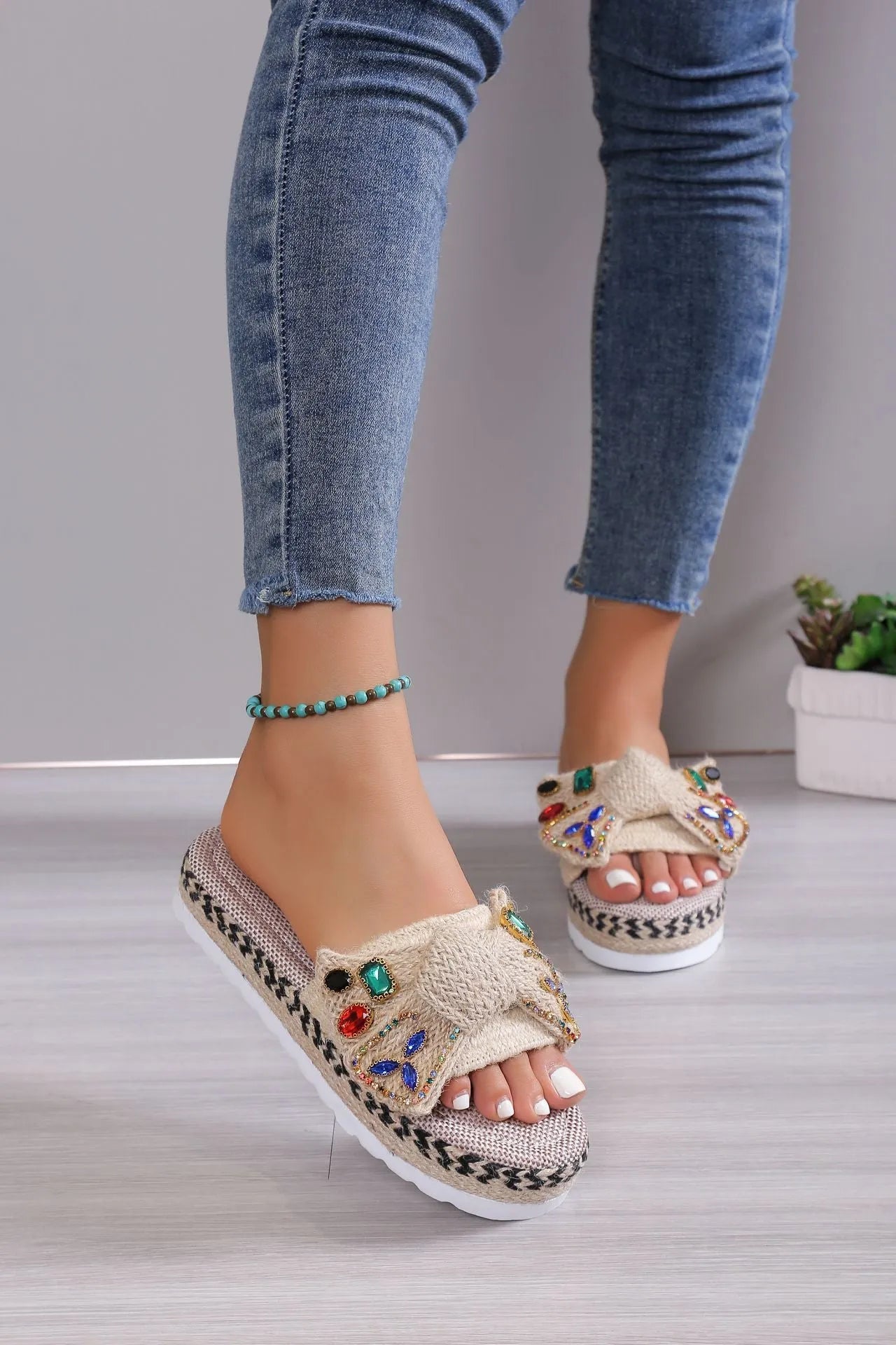 Creamy-white women's platform sandals with a cloth upper, round toe, and a decorative beach bow.