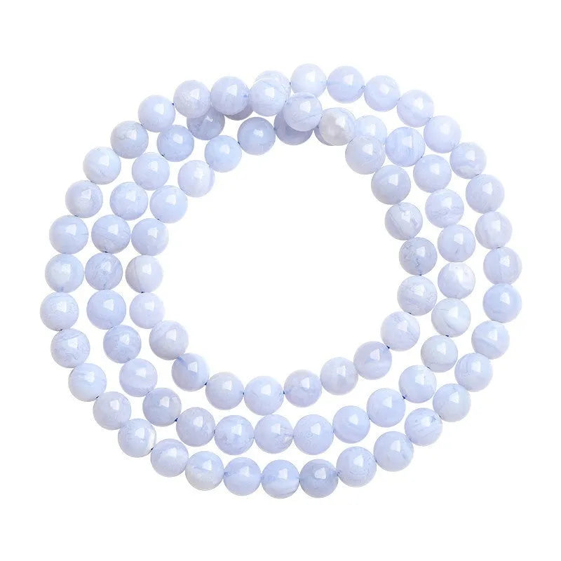 Blue agate bracelet with Ruyi symbol and scattered beads measuring 6-6.8mm.