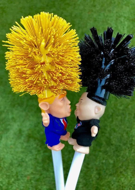 Yellow plastic Donald Trump toilet brush with 40cm length and hanging slot handle
