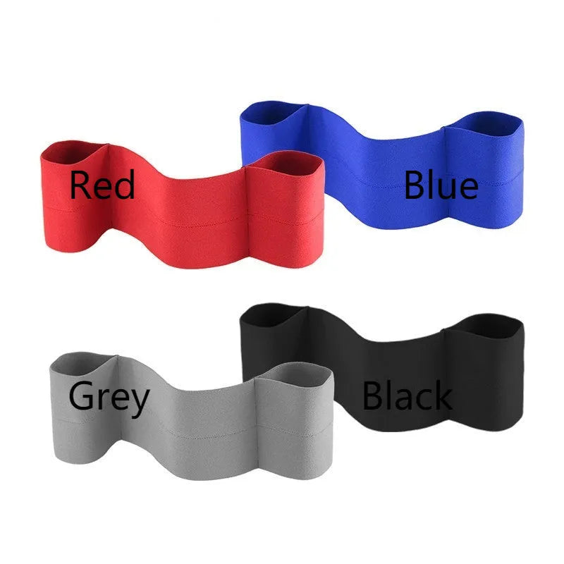 Elastic elbow support bandage in black colour, wrapped around an adult arm.