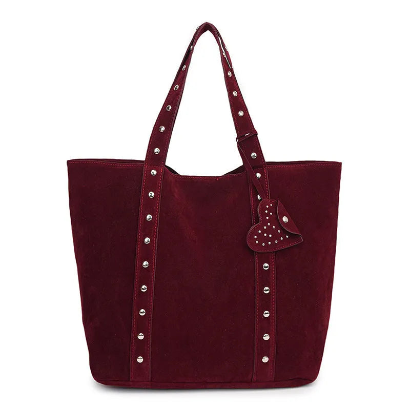 Black PU leather horizontal tote bag with double shoulder straps, showing outer sandwich pocket.