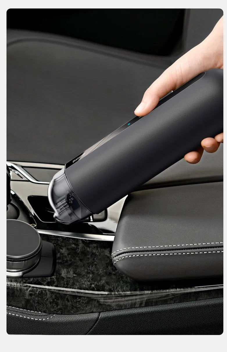Baseus wireless handheld car vacuum cleaner in black, shown with blowing hose attachment and Type-C charging cable.