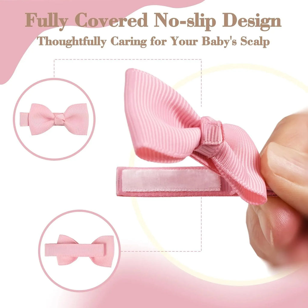 Assortment of pastel-coloured baby hair clips including barrettes and bows on a white background.