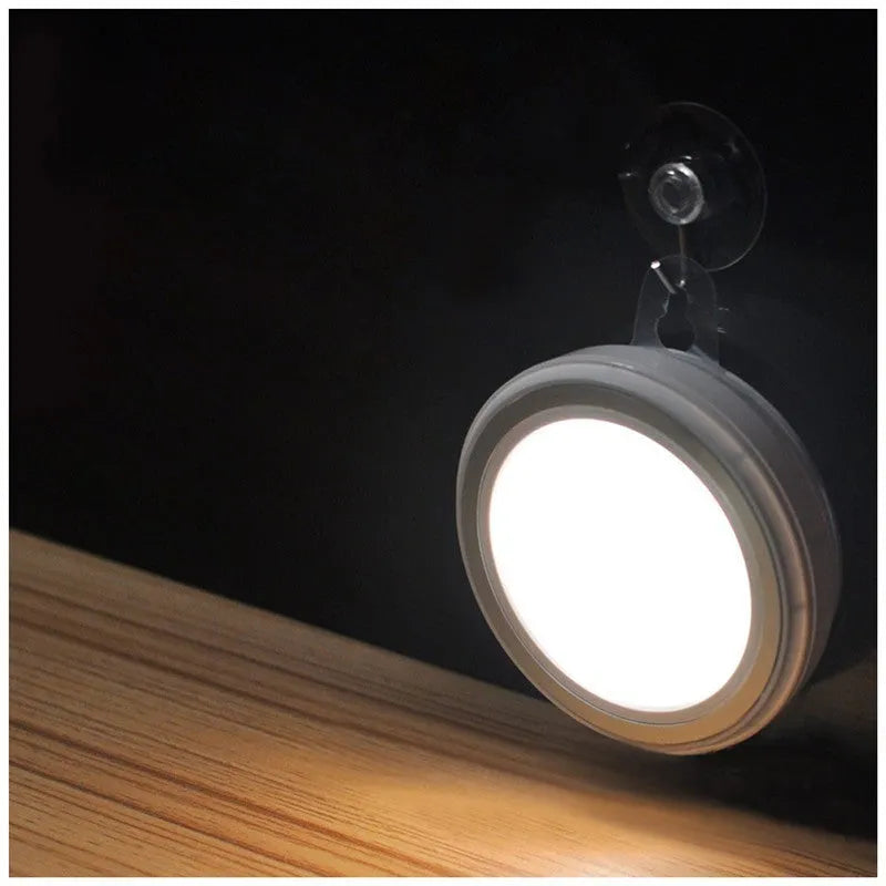 Circular white motion sensor LED light with infrared sensor, 80mm diameter, for wardrobe or corridor.