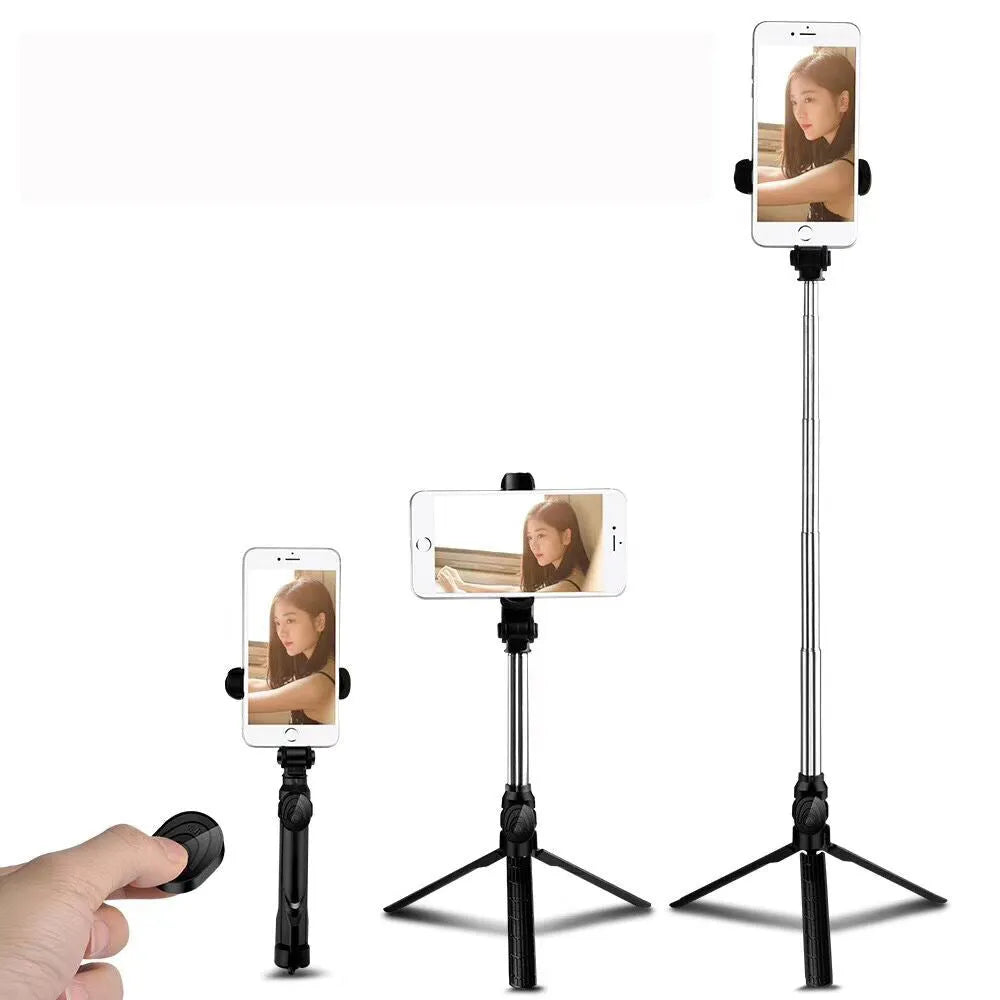Compact black aluminium Bluetooth selfie stick with integrated tripod legs and a 360-degree rotating phone clip.