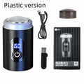 Black mini USB rechargeable electric shaver with cleaning brush and charging cable on a white background.