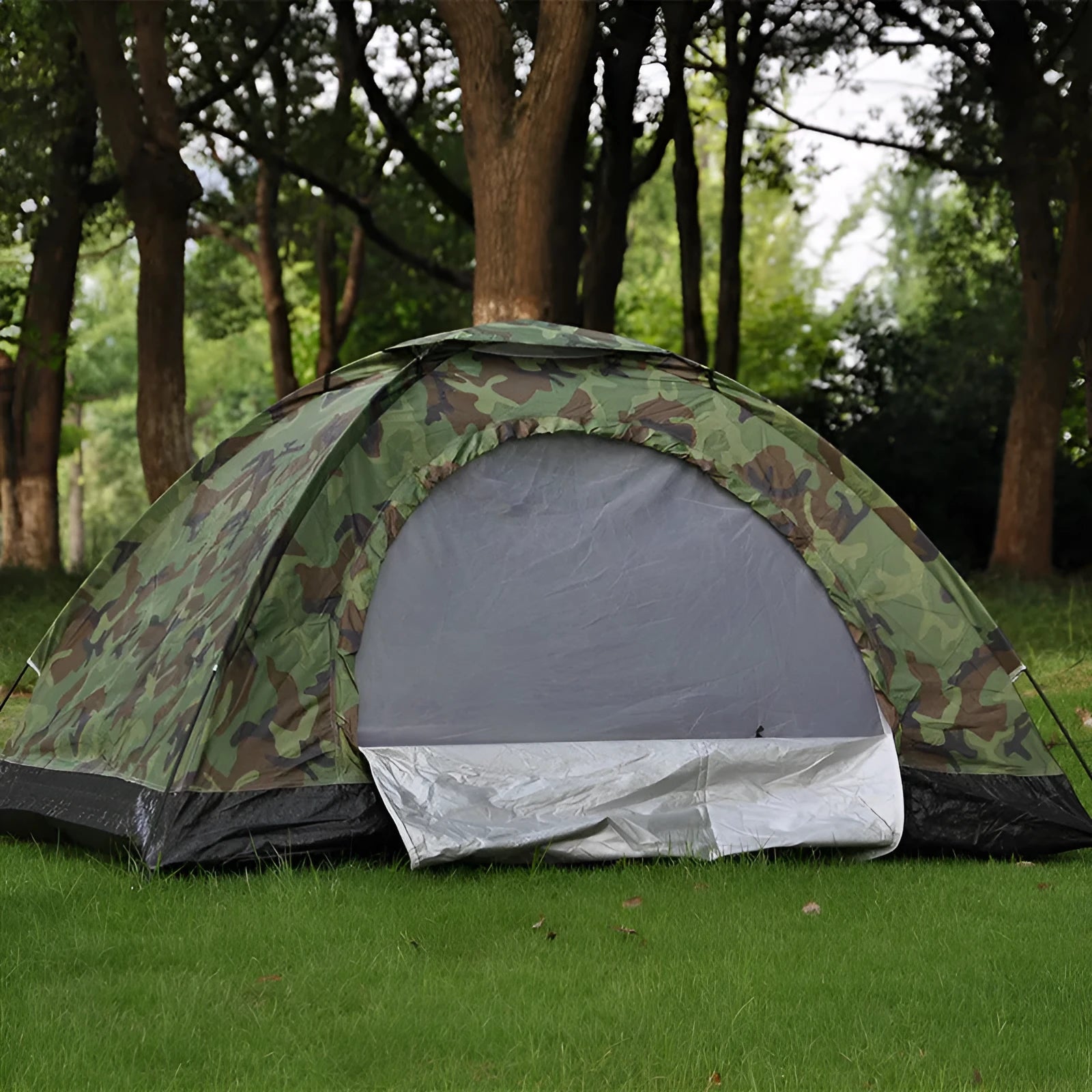 Green camouflage camping tent with steel ground nails and mesh windows for outdoor use