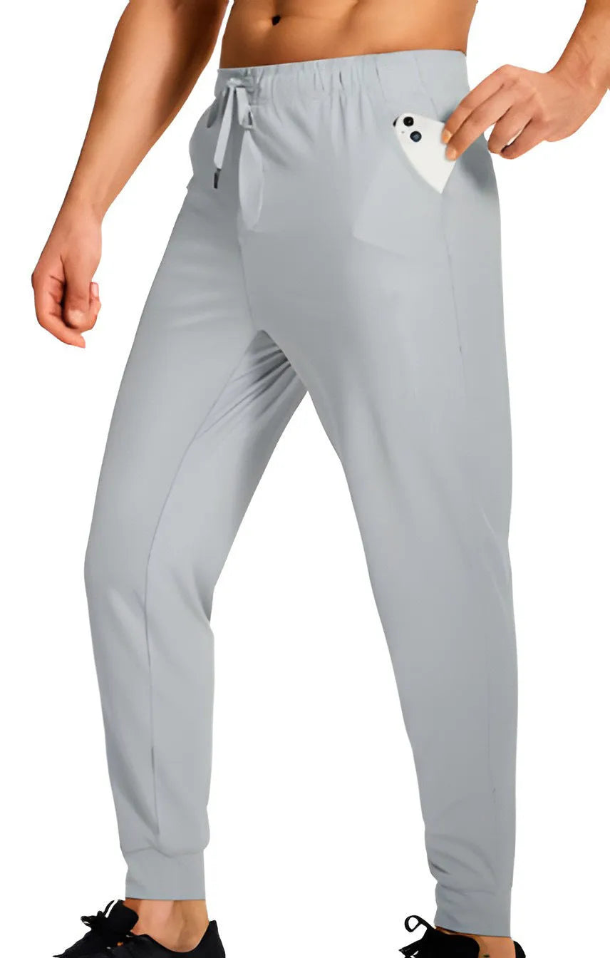 Men's loose fit casual trousers in solid colour polyester fabric showing relaxed cut and casual styling