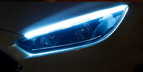 Flexible silicone car LED light strip for daytime running and flowing turn signals, showing wire connections.