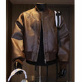 Men's black extended length PU leather jacket on a hanger, showing tight fit and 100cm length.