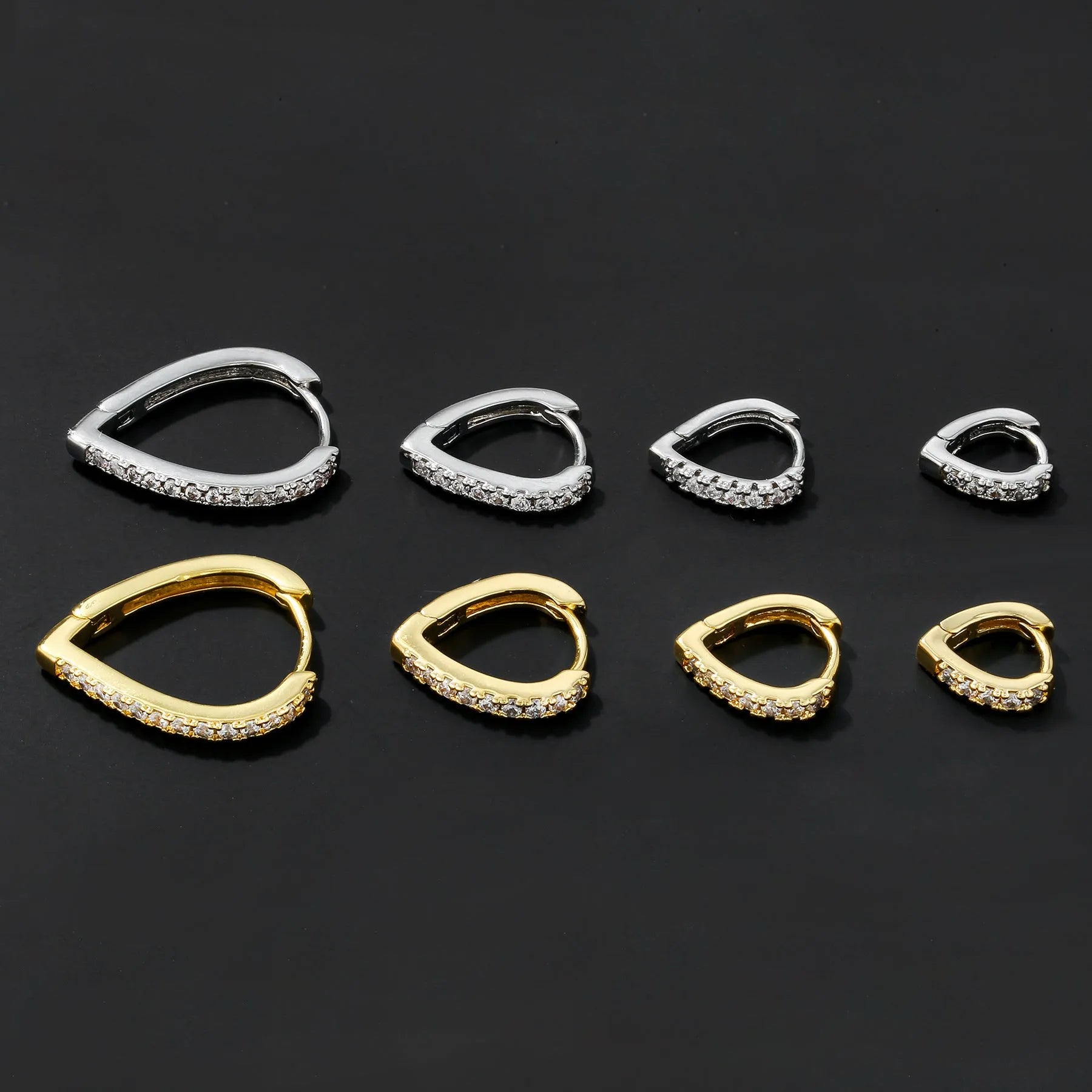 Geometric love heart shaped copper ear clip earring with an electroplated gold finish.