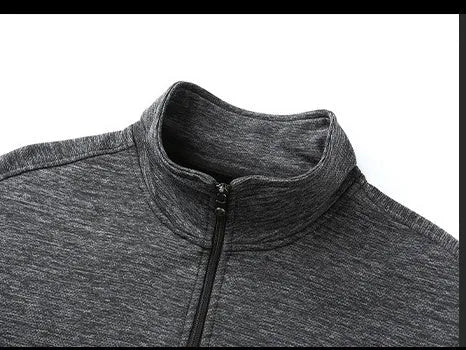 Man wearing a grey athletic-fit casual jacket with a stand-up collar and front zip.